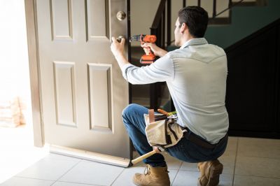 Handyman Repairing a Door